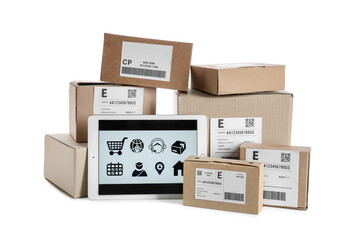Tablet computer with open page of delivery service application and parcels on white background