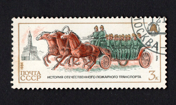 Stamp dedicated to historic fire engine. History of fire fighting equipment