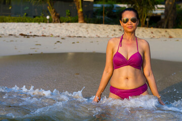 Woman beautiful with sunshine and bikini on water