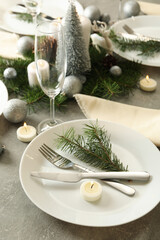 Concept of romantic New year table setting on gray table