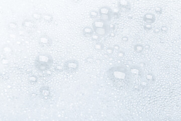 Background of soap foam and bubbles on a white background, macro photography