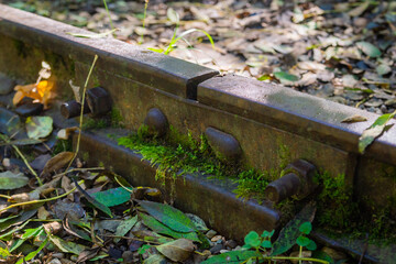 Low angle view of small railway tracks in mountain region with shallow depth of field