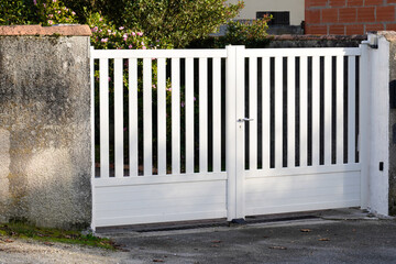 metal steel gate white home fence on suburb street house