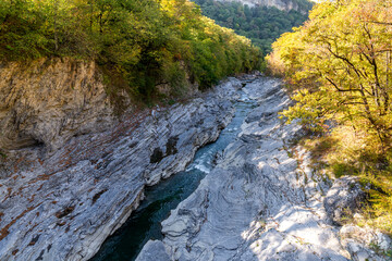 Landscape with a mountain river flowing through canyon