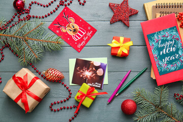 Beautiful greeting cards for Christmas and New Year celebration with gifts on wooden background