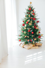 Christmas tree with gifts interior decor for the new year white background