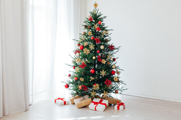 Christmas tree with gifts interior decor for the new year white background