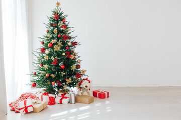 Christmas tree with gifts interior decor for the new year white background