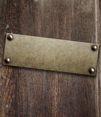 Grunge background with metallic plate on wood board