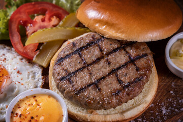 Tasty grilled burger with ingredients. Delicious burger