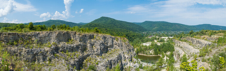 Panorama of abandoned and flooded quarry