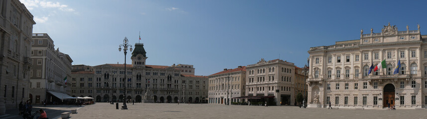 Fototapeta na wymiar Piazza Unità d'Italia in Trieste, surrounded by numerous buildings like Palace of Lloyd, Palace of the Austrian Lieutenancy and with the Town Hall in the background