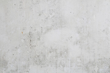 Gray concrete wall peeled of wallpaper. Concrete background.