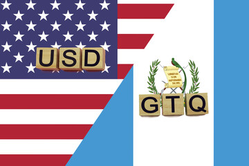 USA and Guatemala currencies codes on national flags background