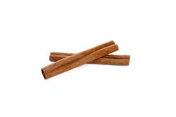Two cinnamon sticks on a white background