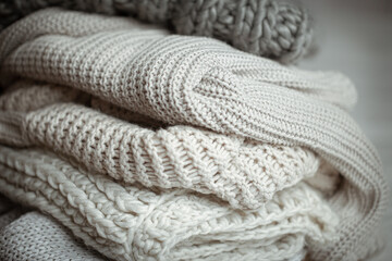 Fototapeta na wymiar Close up of neatly folded knitted items close up.