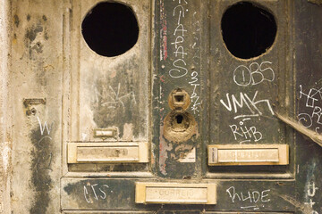 close up on letter boxes and decrepit door in the old town of Porto, Portugal

