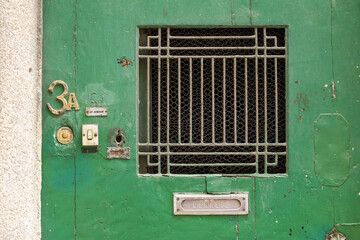 close up on letter boxes and decrepit door in the old town of Porto, Portugal


