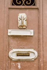 close up on letter boxes and decrepit door in the old town of Porto, Portugal

