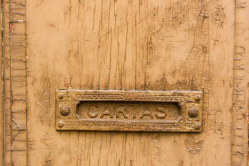 close up on letter boxes and decrepit door in the old town of Porto, Portugal

