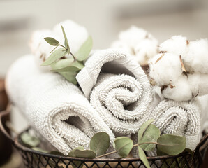 Spa composition with bath towels and cotton close up.
