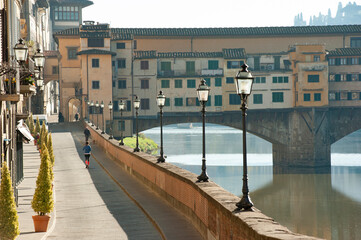 Florence, Italy - 2020, November 19: Very few people on Lungarno, during Covid-19 pandemic...