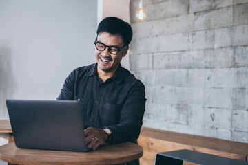 using computer.man work hand typing laptop keyboard contact us online chatting search form internet...