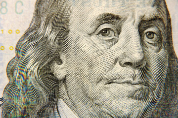 Close-up portrait of the President on a hundred-dollar bill
