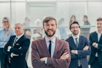 happy young entrepreneur standing in the office