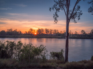 Beautiful Riverside Sunset with Reflections