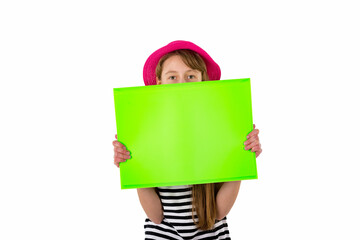 Happy girl child and hiding under empty blank paper isolated on white background. copy space