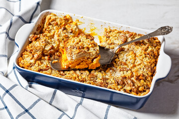 Pumpkin dump cake on a white marble background