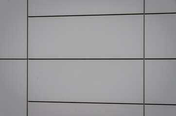 Modern white facade of a building as a texture or background. High quality photo