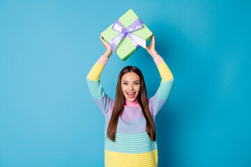 Fototapeta na wymiar Photo of astonished crazy girl get receive dream gift box raise scream wear sweater isolated blue color background