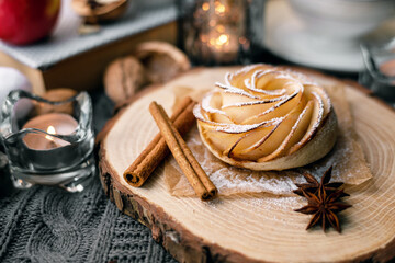 Hot homemade cakes. Sweet healthy dessert for tea. Served wooden platter with apple french bun. Gourmet cake. Correct healthy nutrition. Provence.