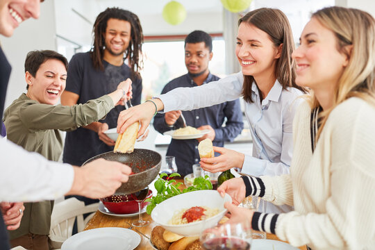 Vegans At Meal In Shared Kitchen Spaghetti And Side Dish