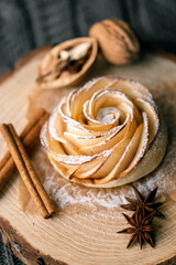 Fototapeta premium Hot homemade cakes. Sweet healthy dessert for tea. Served wooden platter with apple french bun. Gourmet cake. Correct healthy nutrition. Provence.