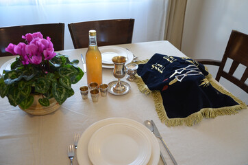 shabbat image. challah bread, shabat wine and candles. shabbes table, top view