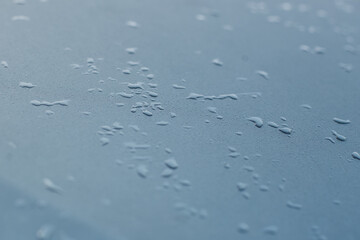 water drops on dark metal background 