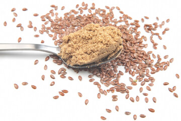 ground flaxseed on a white background. vitamins and healthy food
