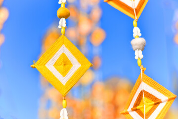 Hanging handmade hexagonal colorful knitting yarn flags. Colorful drape, Blown in the traditional...