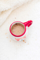 Ceramic santa cup of christmas splattered coffee with cinnamon