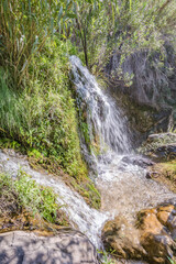 Park of waterfalls with green clean water ponds (Toll del Baladre, Las Fuentes del Algar / Algar fountains, Callosa de Ensarria) Alicante province, Spain.
