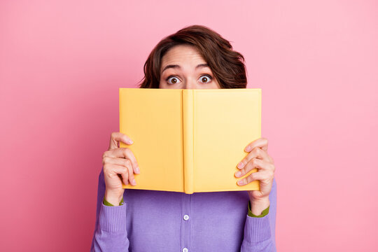 Closeup photo of funny lady hold open diary hide facial expression wear purple jumper isolated pink color background