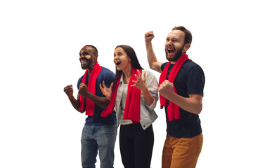 Togetherness. Multiethnic soccer fans cheering for favourite team with bright emotions isolated on...