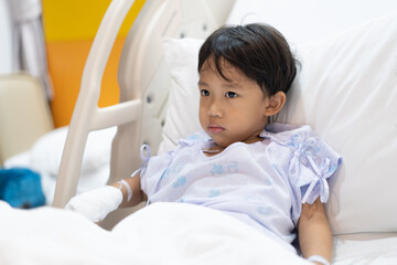 A patient boy is a sick flu in the hospital, He has a cheerful heart.