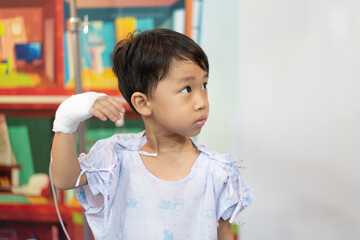 A patient boy is a sick flu in the hospital, He has a cheerful heart.