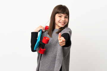 Little girl isolated on white background with a skate and pointing to the front
