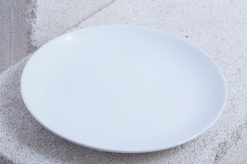 empty plate and fork. On a white background.