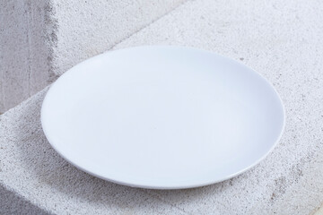 empty plate and fork. On a white background.